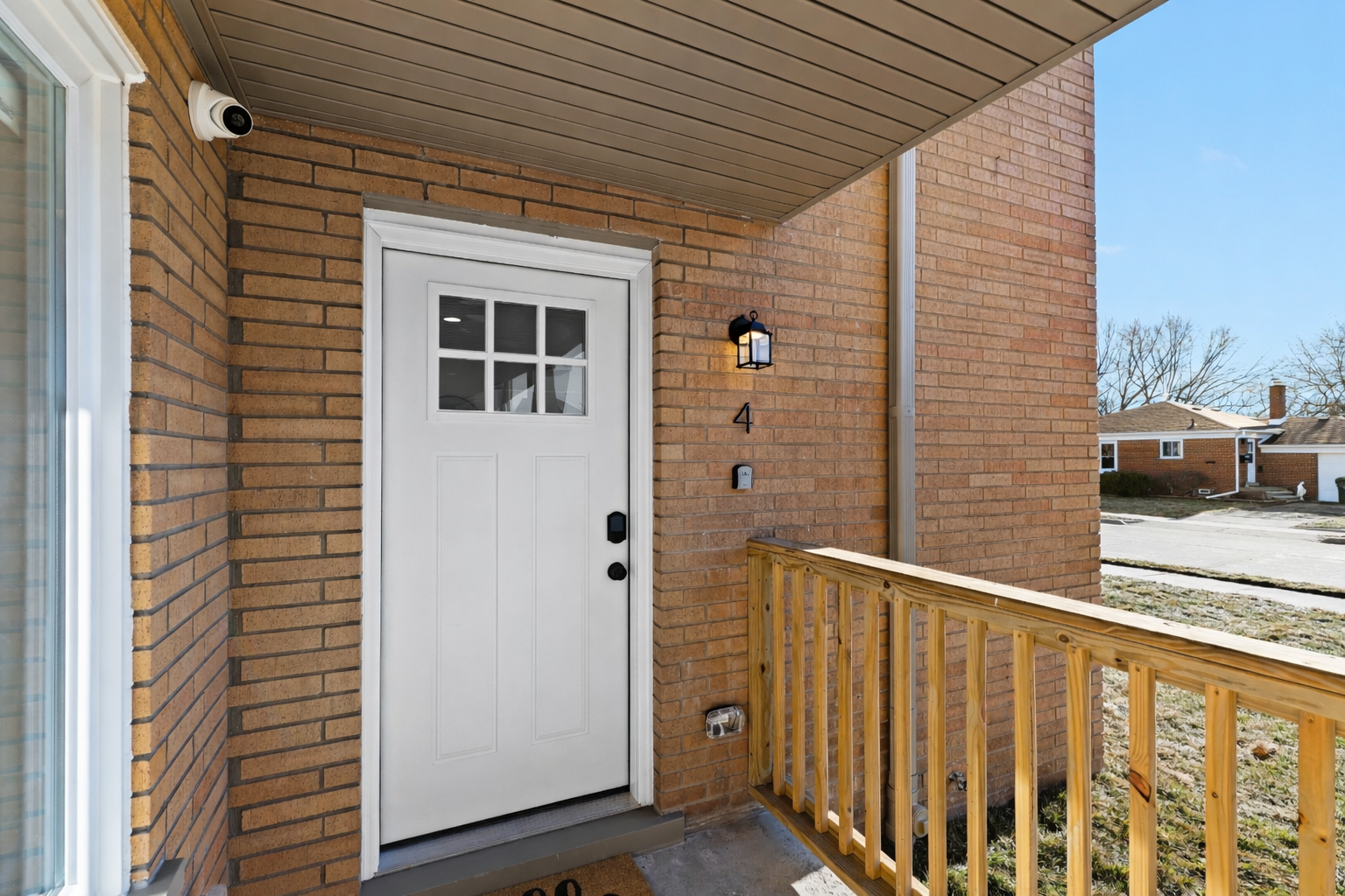 Inviting private entry with a covered porch, secure smart lock, and soft exterior lighting—welcoming you home with charm, comfort, and easy access.