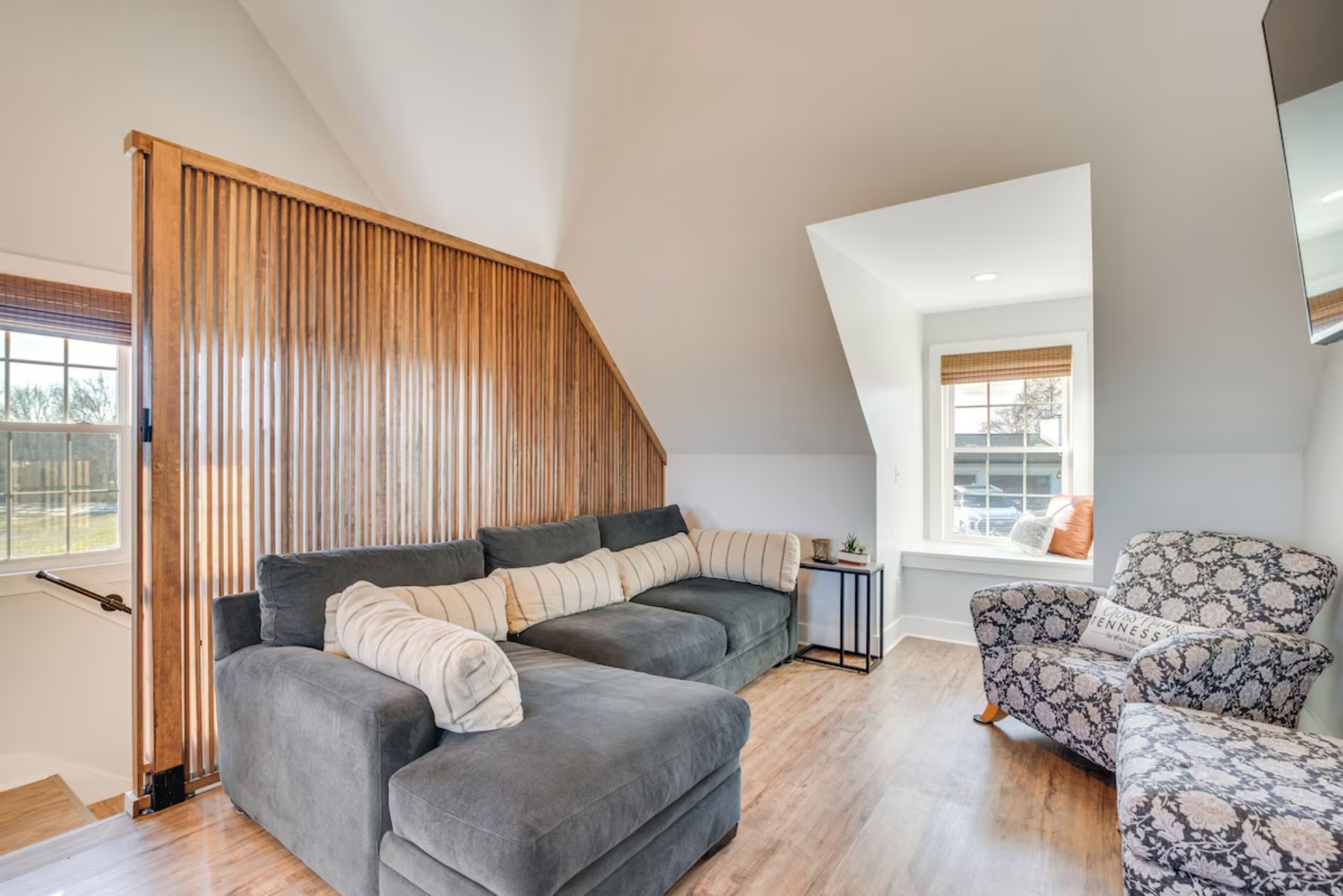 Living area with ceiling fans and smart TV