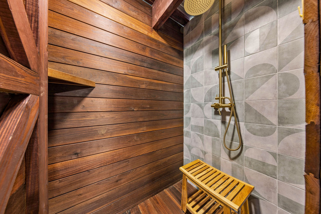 Private outdoor teak shower with rain head