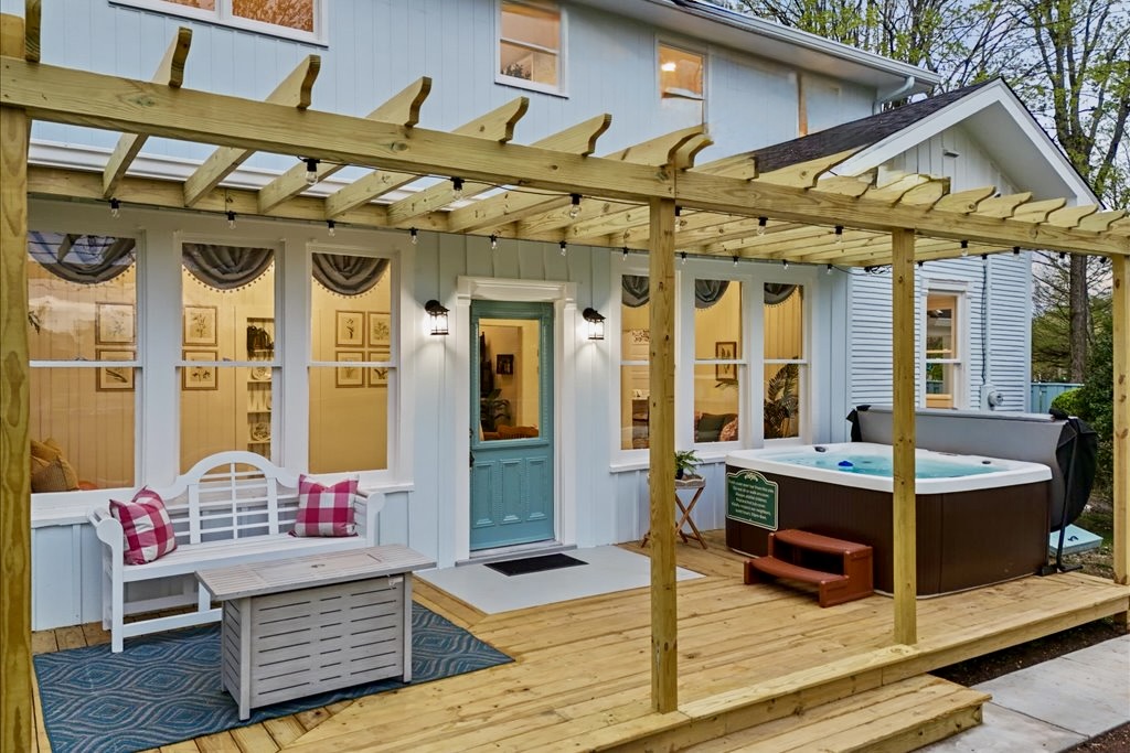 Soak in the hot tub in the tranquil setting under the string lights and starlight.