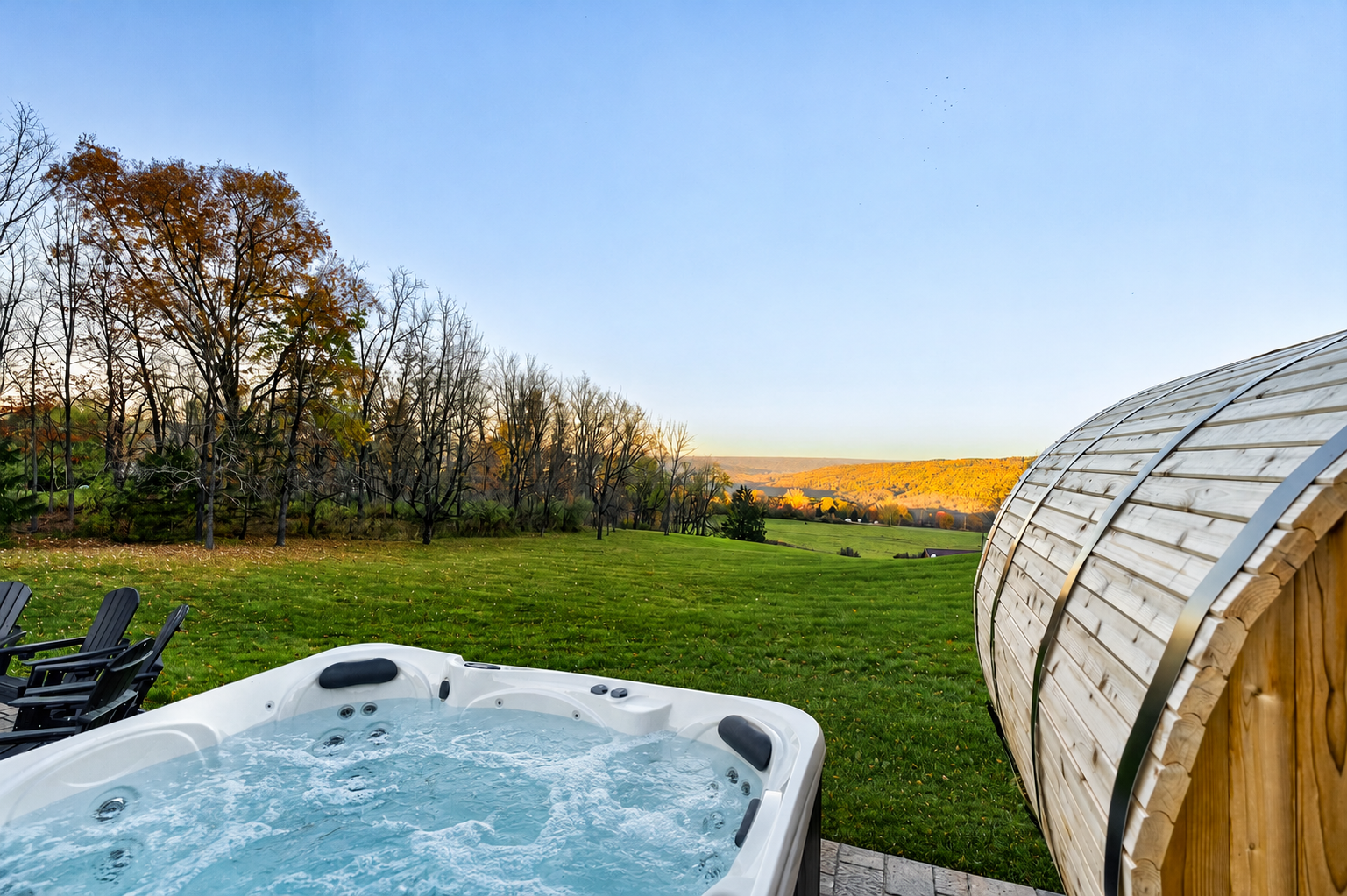 Outdoor hot tub beside the barrel sauna
