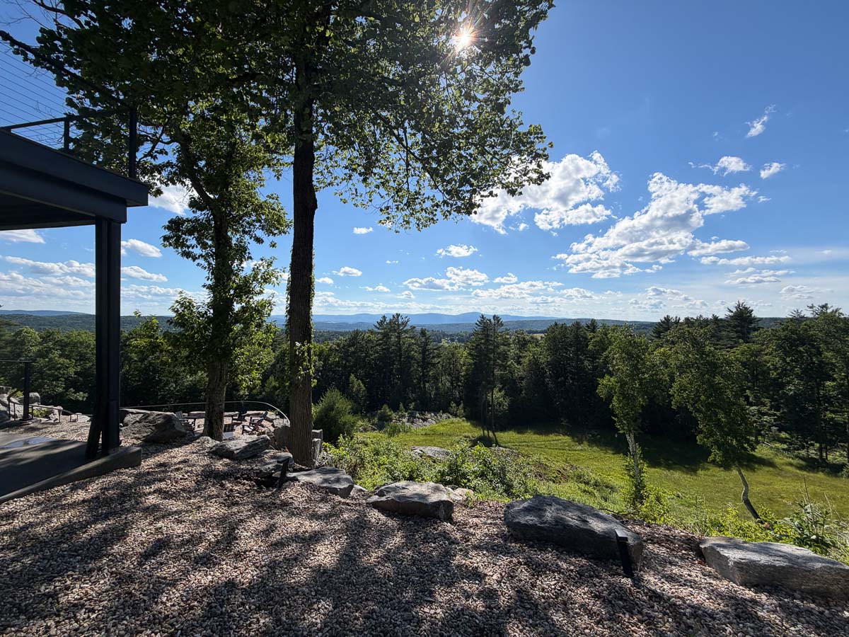 View from the tavern stone terrace on a summer afternoon, blue sky over the Berkshires valley &mdash; Sunset Falls