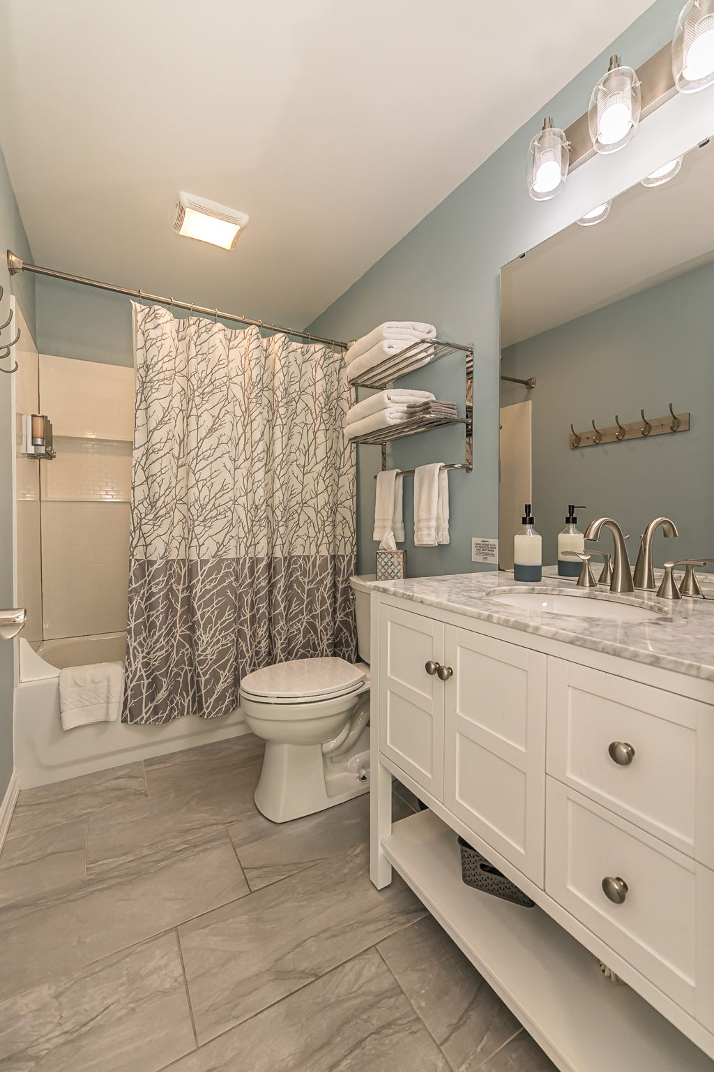 This bathroom is attached to bedroom 5. It has a tub/shower combo.