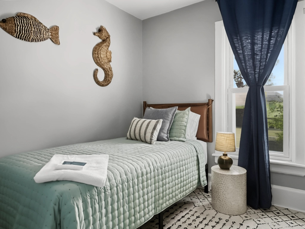 Twin XL bed (long enough for tall folks) sleeps 1