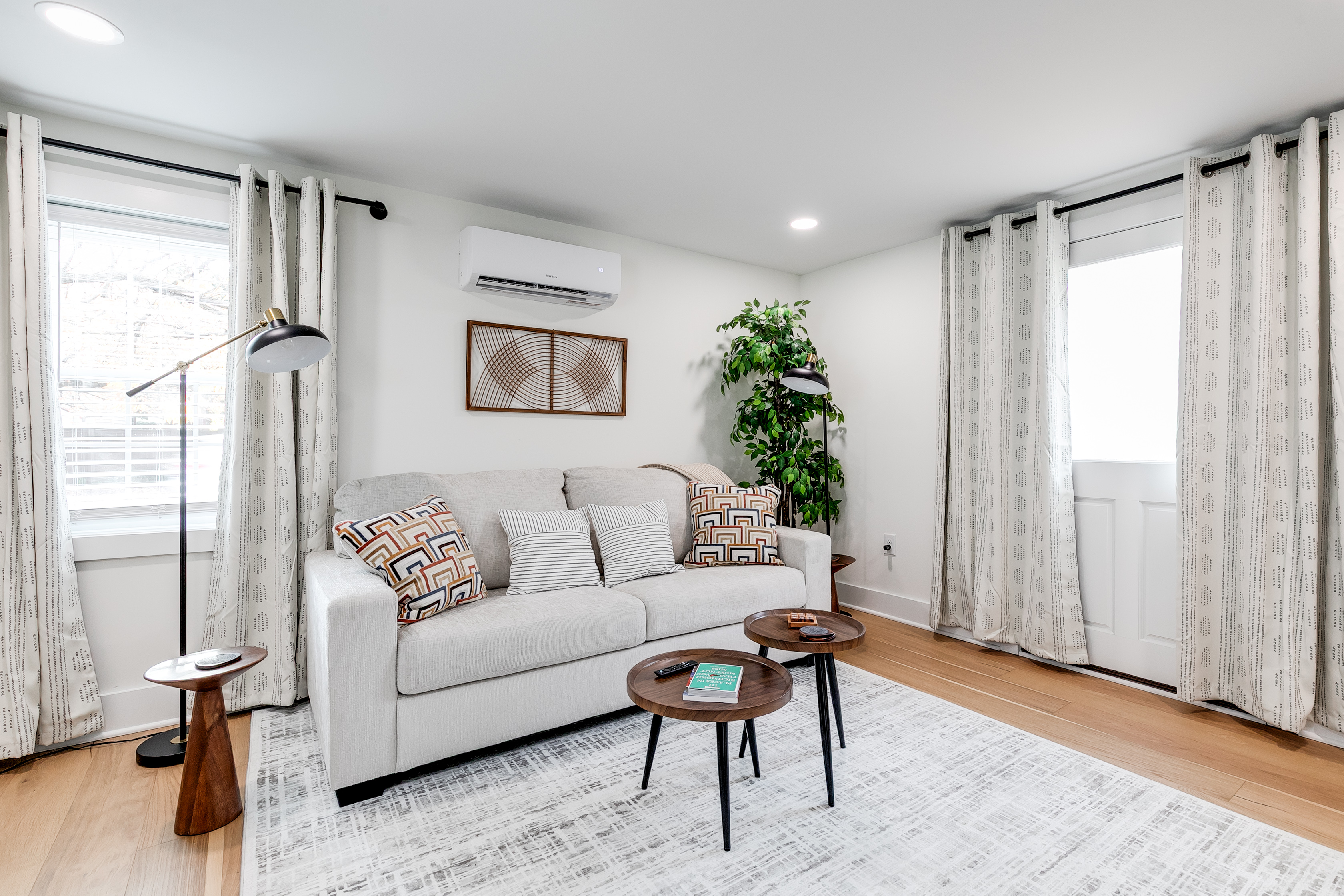 Living Room: Bright and airy space with stylish decor, perfect for relaxing after a day of adventures!