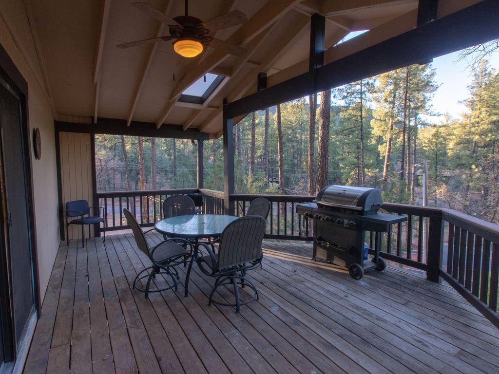 3 deck off the kitchen with seating for 12 Gas grill with propane.