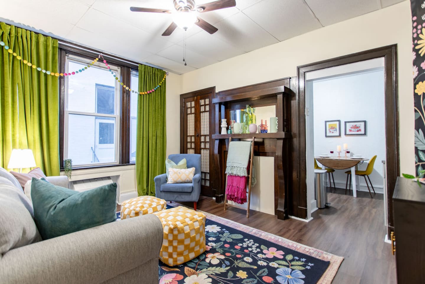 Bright and spacious living room featuring a comfortable sofa bed, perfect for relaxing or accommodating extra guests.