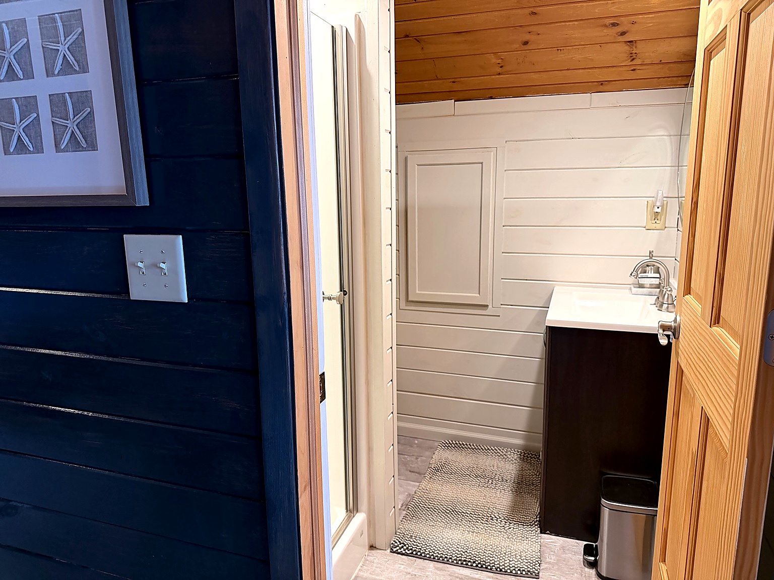 Upper-level bathroom right at the top of the stairs, conveniently located off the loft and second bedroom for easy mornings and quick refreshes.