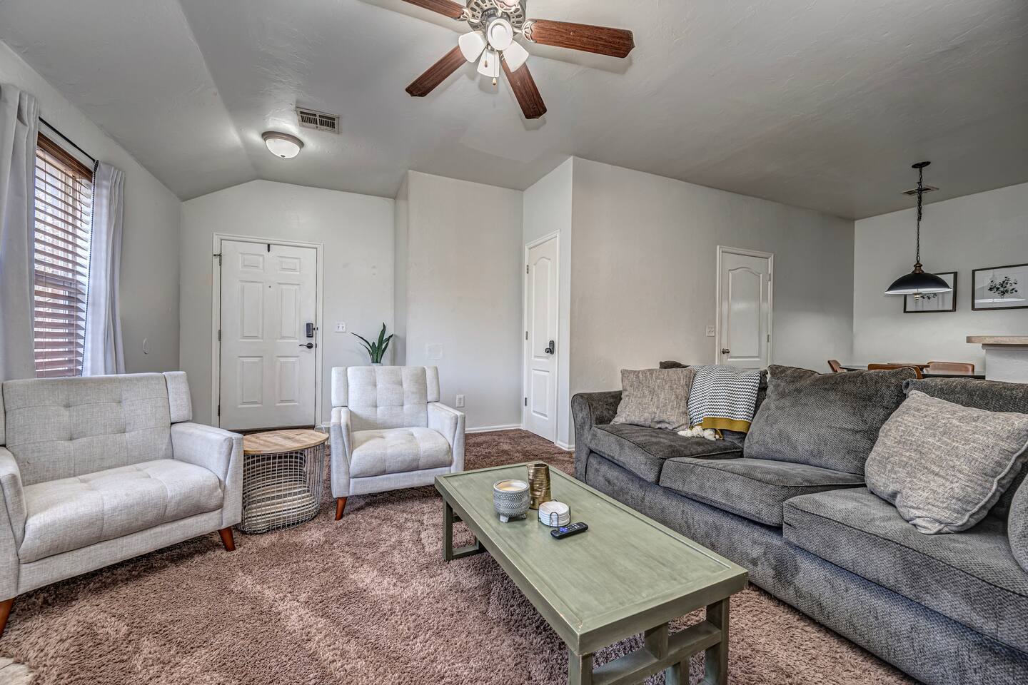 Inviting living room with smart TV, fireplace, and plenty of comfort.