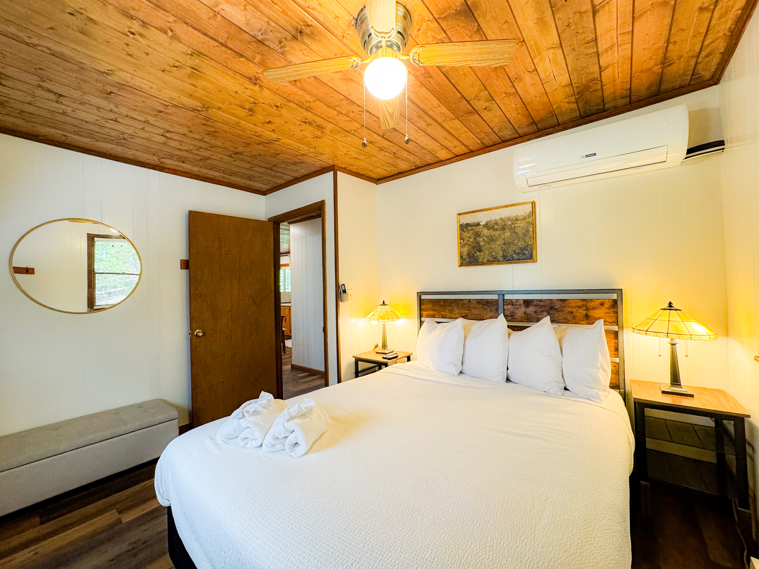 Bedroom one on the main level features a queen bed with comfy, high thread count sheets and linens.