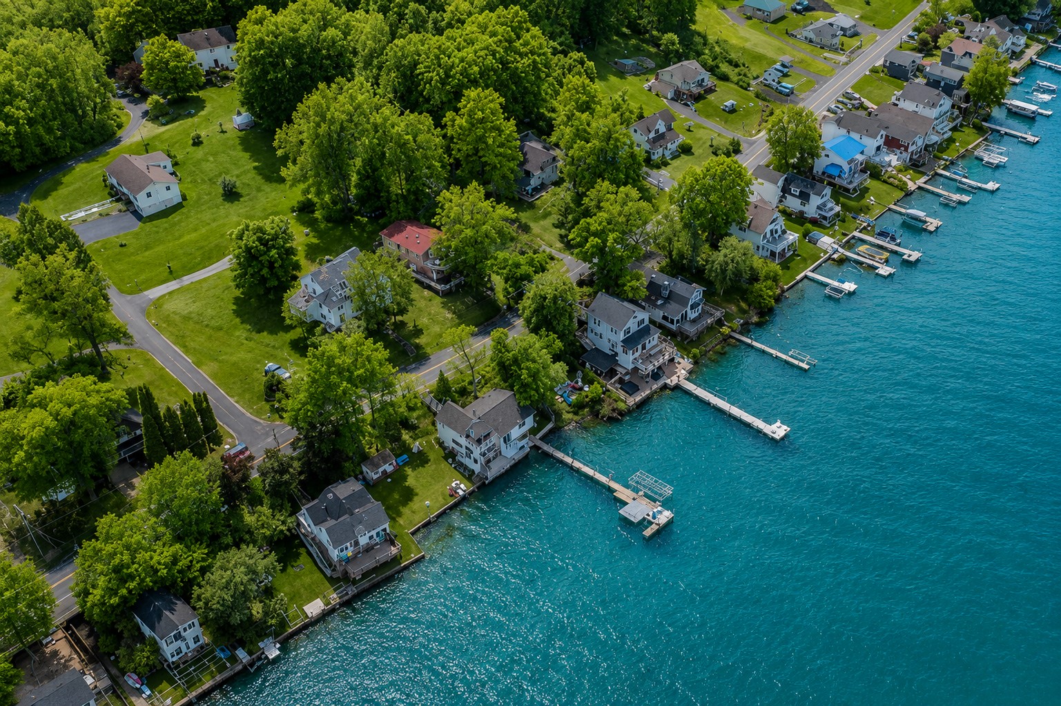 Aerial shot showcasing expansive lakefront entertaining space, hot tub, and private dock for the ultimate getaway 🎯🌊🍹