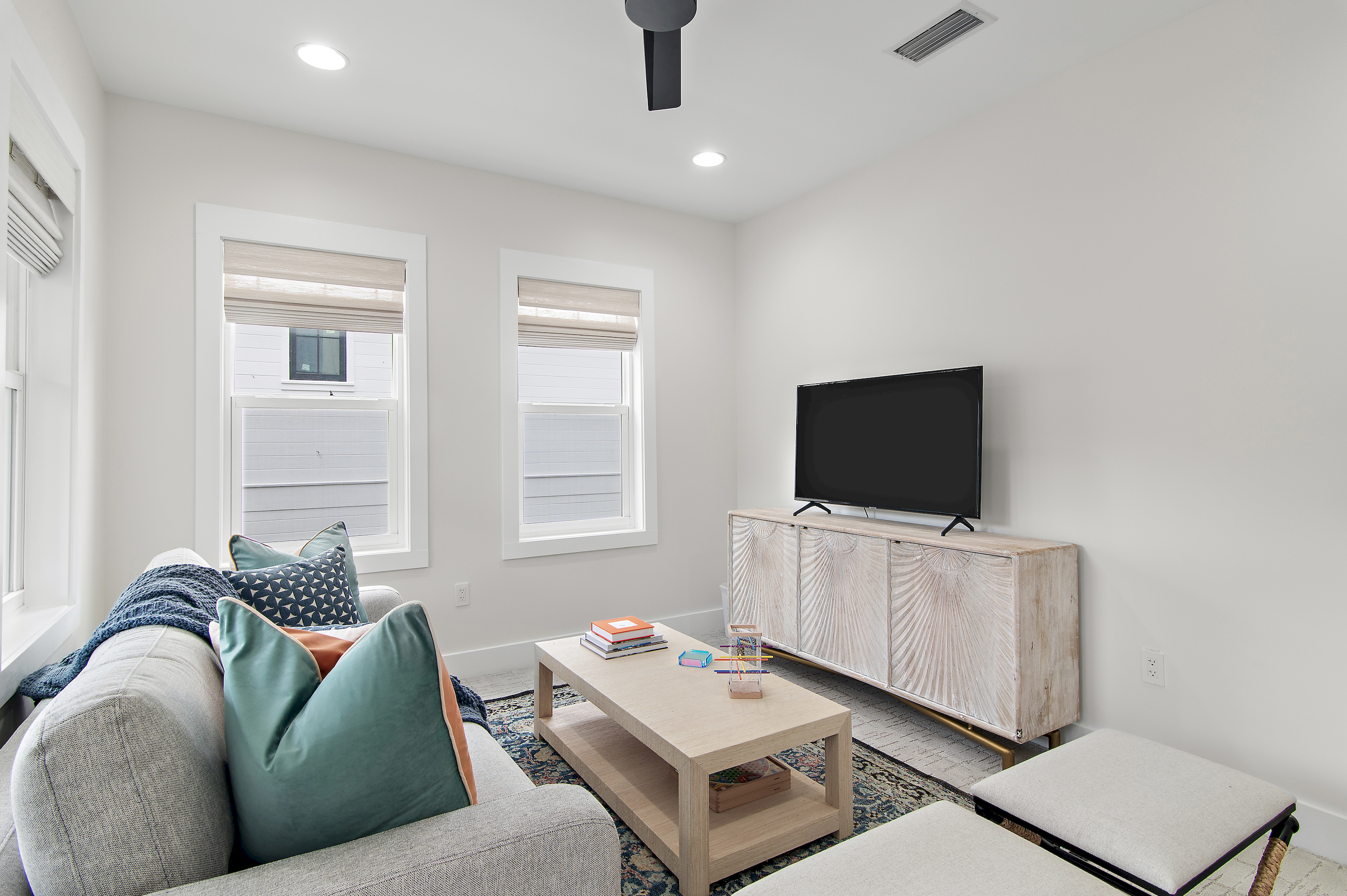 A large smart TV is perfect for streaming movies in the upstairs living room/playroom.