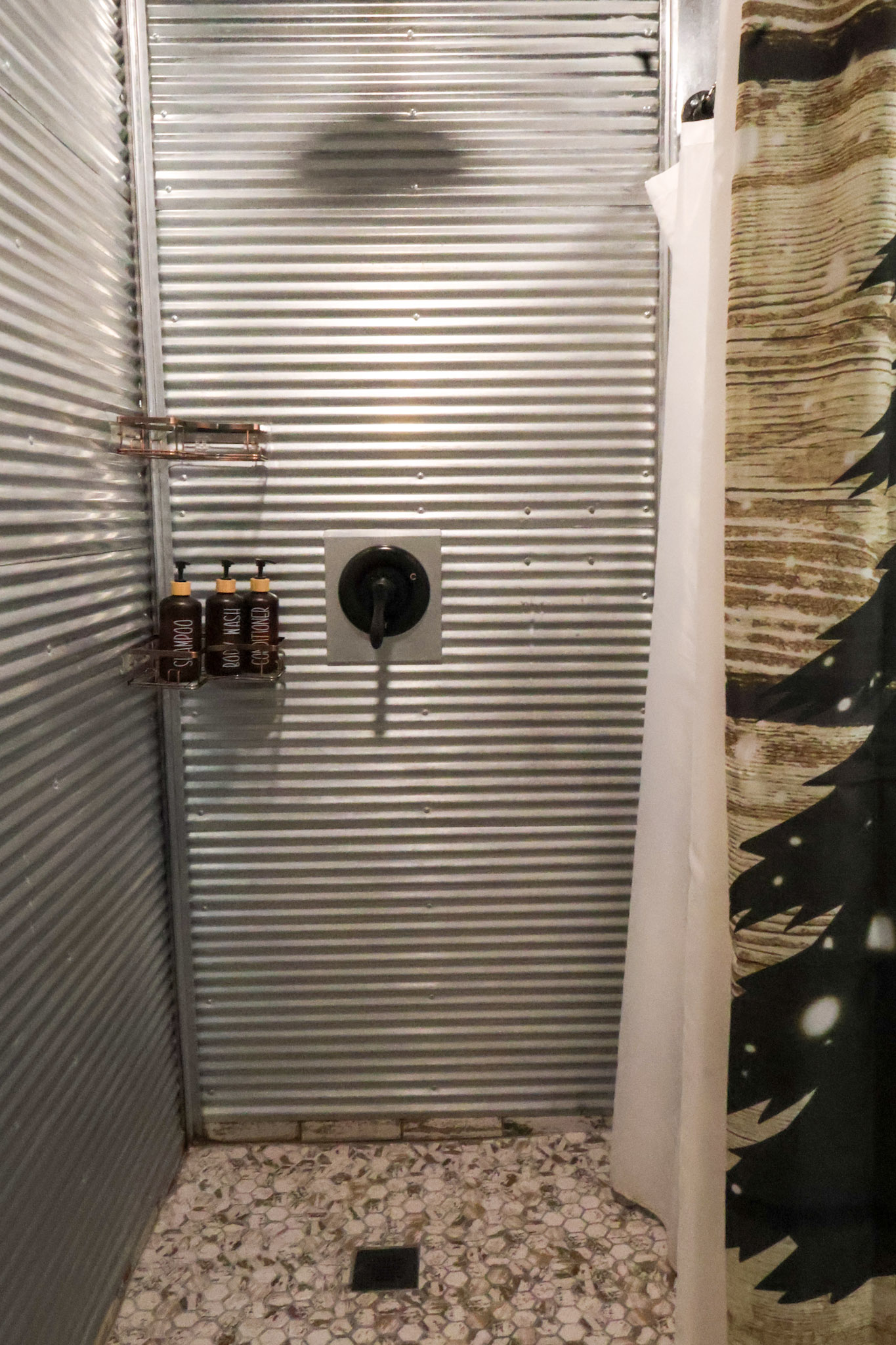 Surrounded by faux tin w/ a rainshower head. Plenty of room for two people