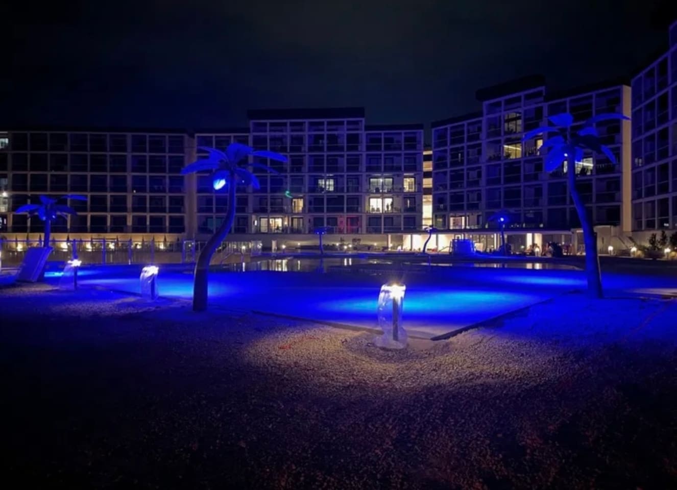 Pool has lights for night time swimming and gathering in common spaces