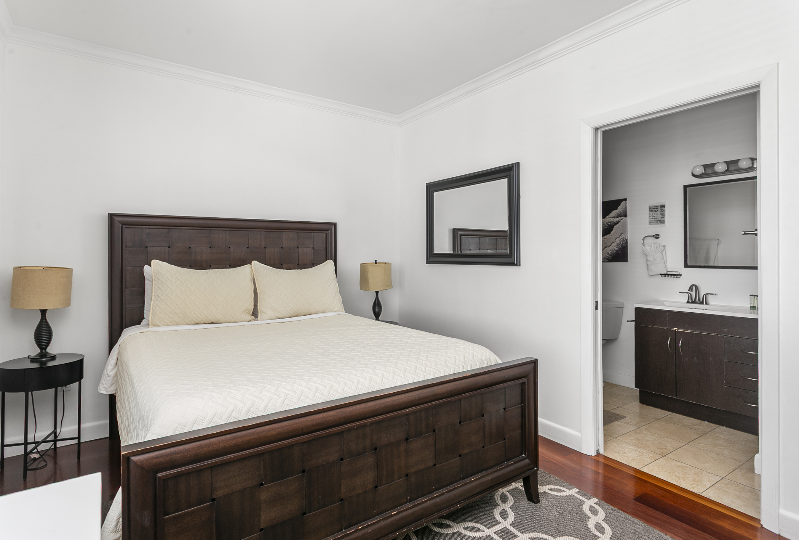 Guest Suite with en-suite bath, closet storage, and room-darkening curtains