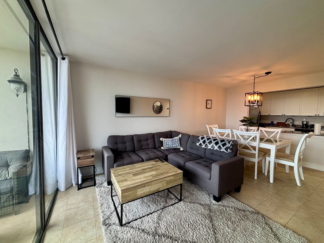 A large TV and comfortable couch is yours to enjoy throughout your stay.