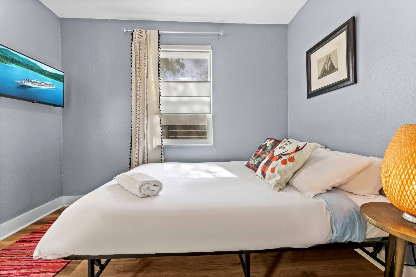 bedroom 2 with queen bed and TV