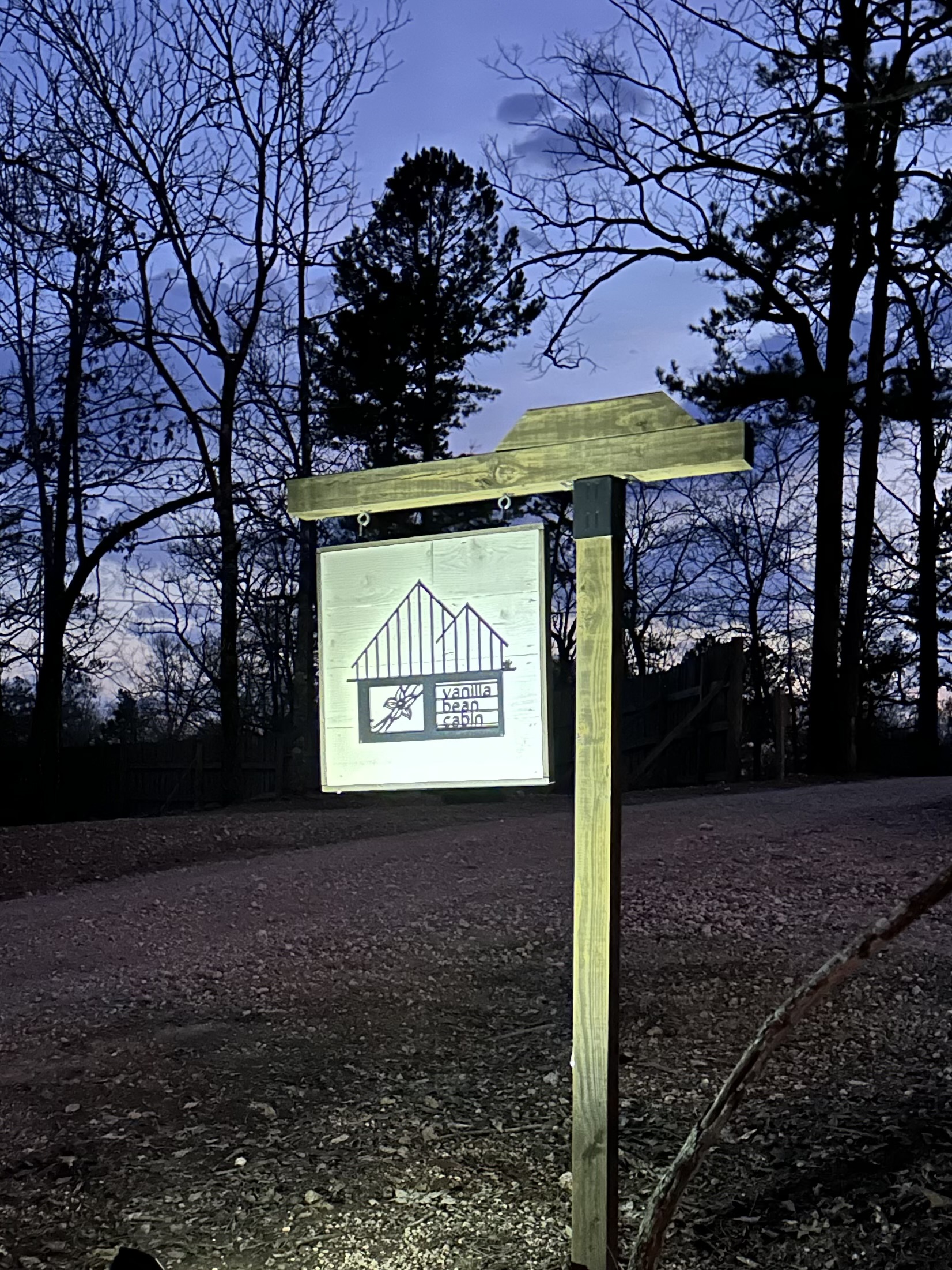 You won't miss us with our original Vanilla Bean Cabin sign with landscape lighting as the sun sets!