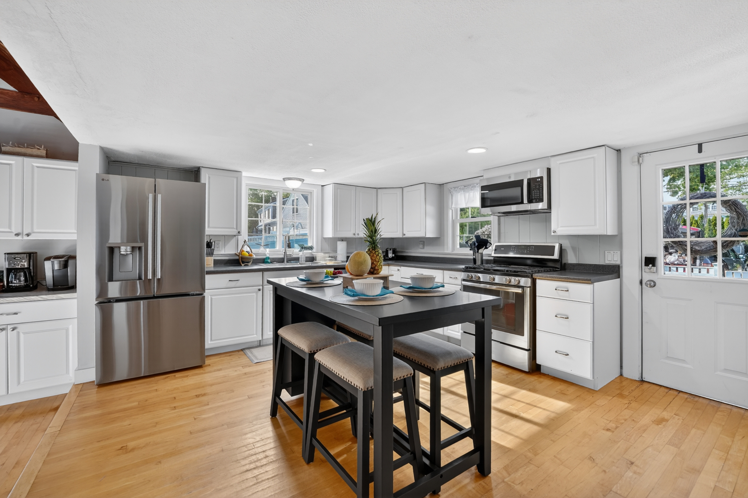 Stylish kitchen with generous counter space and seating for casual dining.