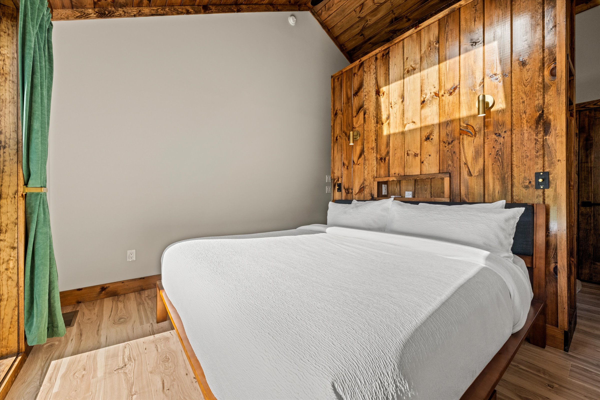A king size bed provides a good night's sleep with easy access to the bathroom from the walk around headboard wall