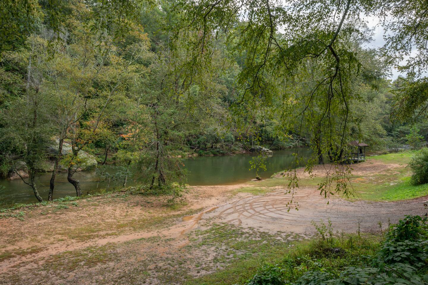 Old Swimming Hole. 
Located when you enter the main gate to the right. You will see the sign, drive down and enjoy the river!