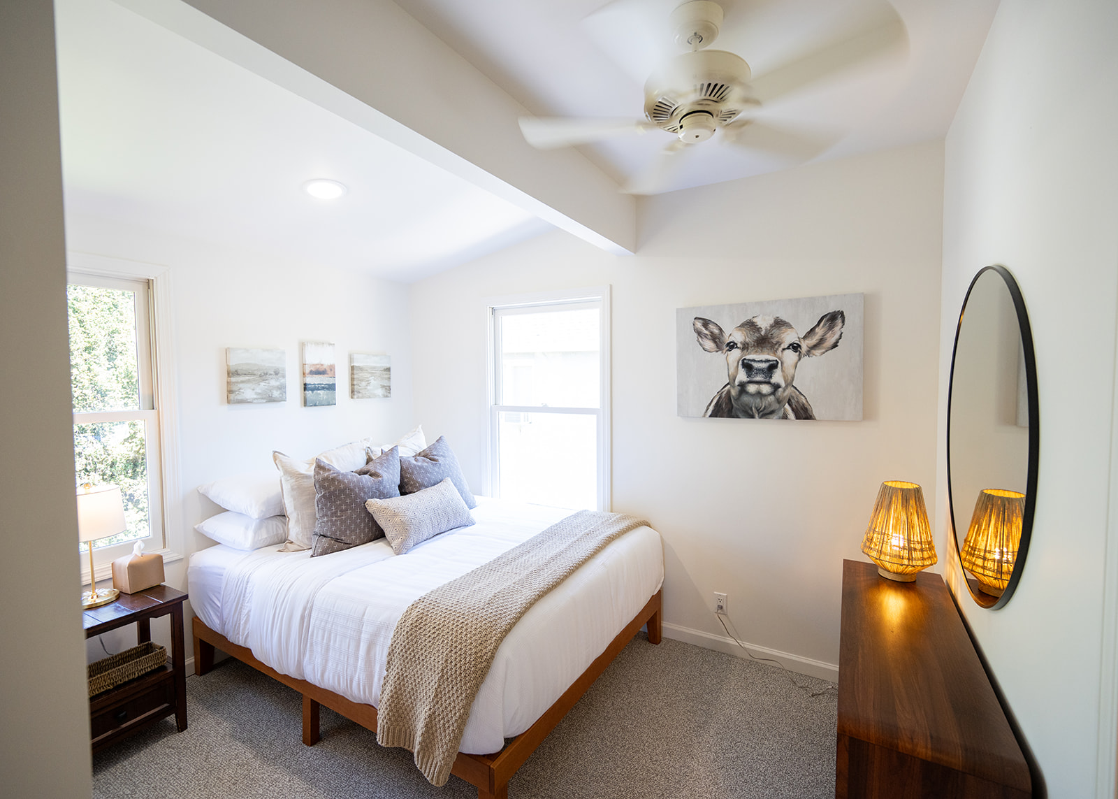Comfortable bedroom featuring a queen bed, soft linens, and a calm setting for a restful night’s sleep