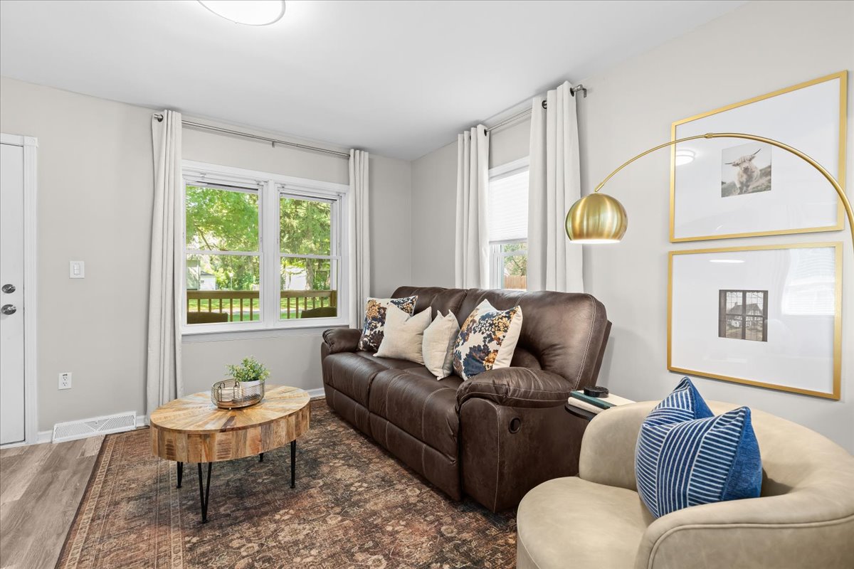 Inviting second living area with comfortable seating and large window views