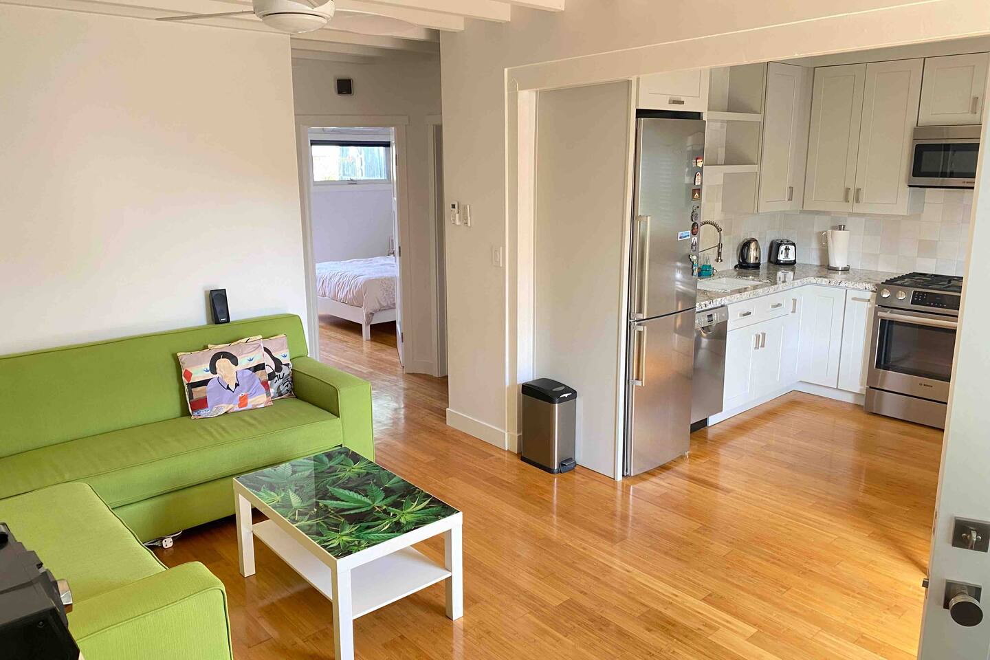 Living room with a sectional sofa and entertainment setup.