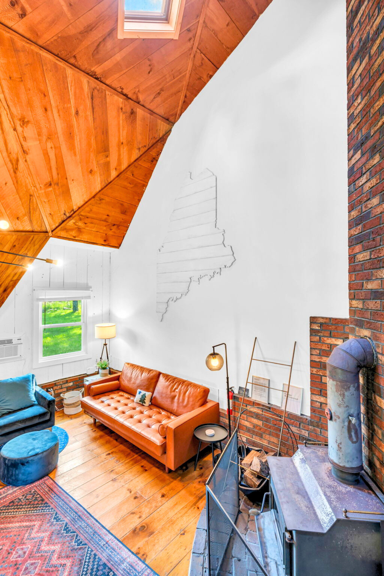 Get cozy on our comfortable leather couch and embrace the warmth of the inviting fireplace. Relax, unwind, and make lasting memories in this perfect retreat for ultimate comfort!