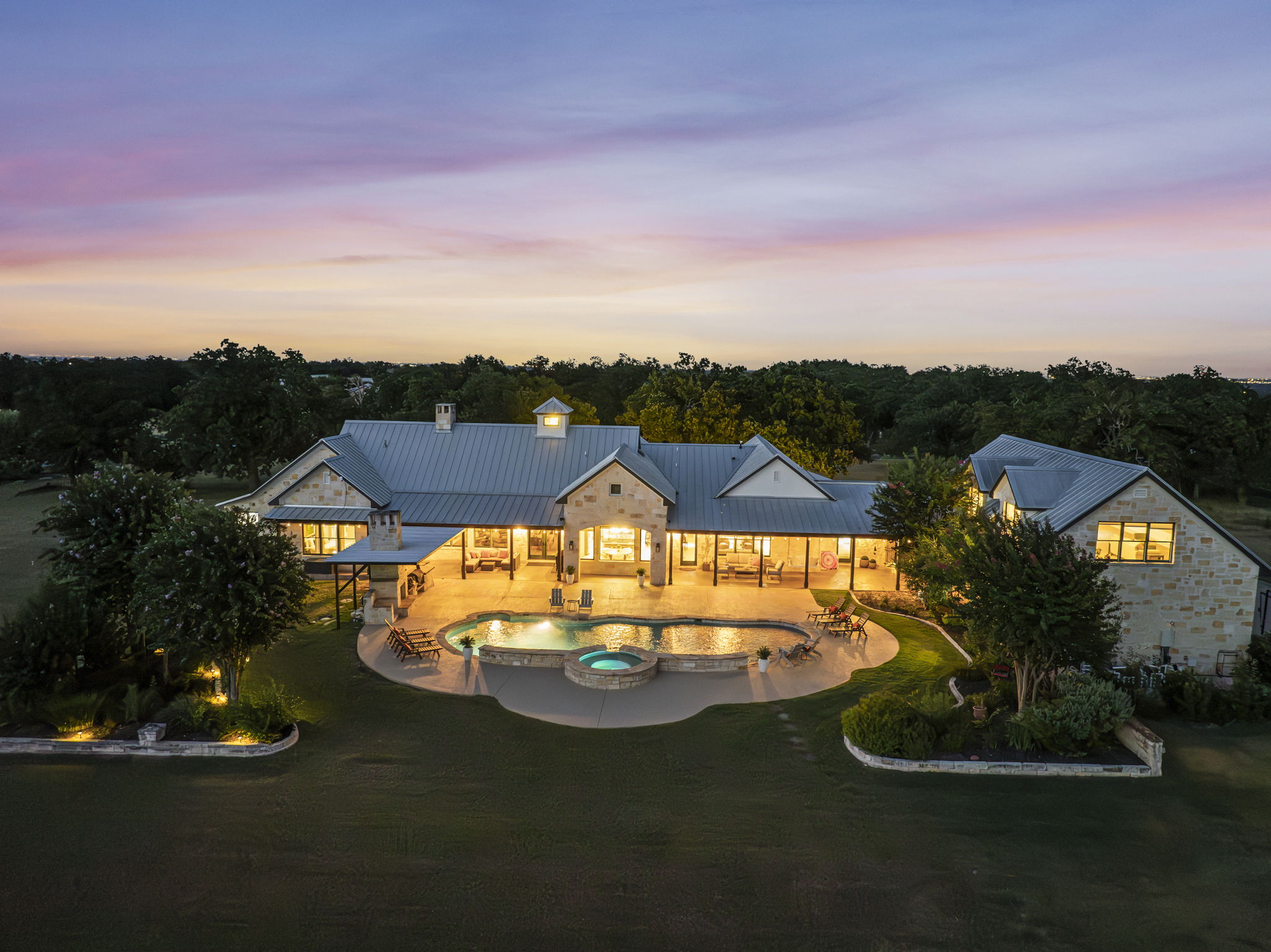 Aerial view at dusk, with glowing lights creating a peaceful twilight ambiance.