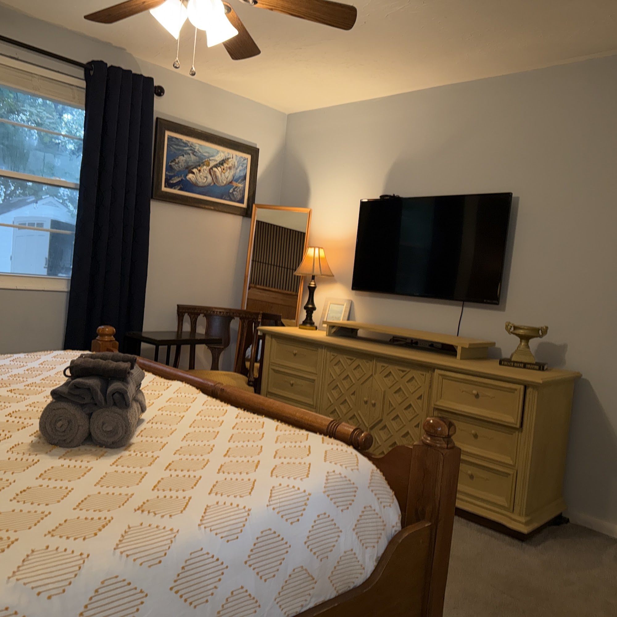 Bedroom 1: king bed, dresser and TV