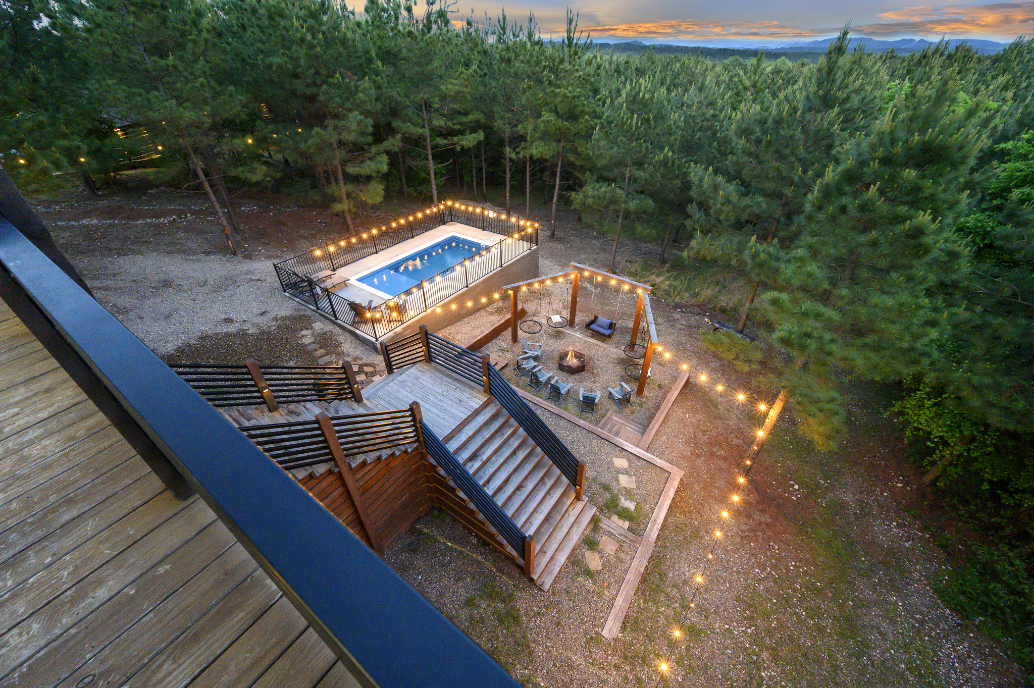 Secluded Hochatown cabin surrounded by towering pines with multi-level decks, scenic views, and complete privacy.