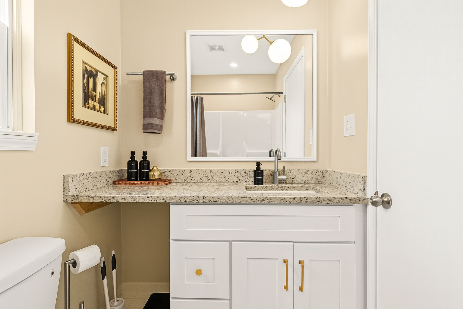 Our bathroom showcases an uncomplicated yet efficient layout, featuring a convenient vanity for your comfort.