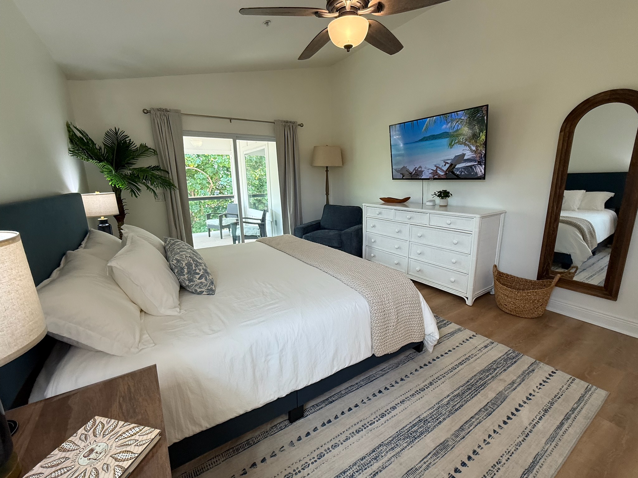 Spacious main floor master suite with room darkening shades and a private balcony