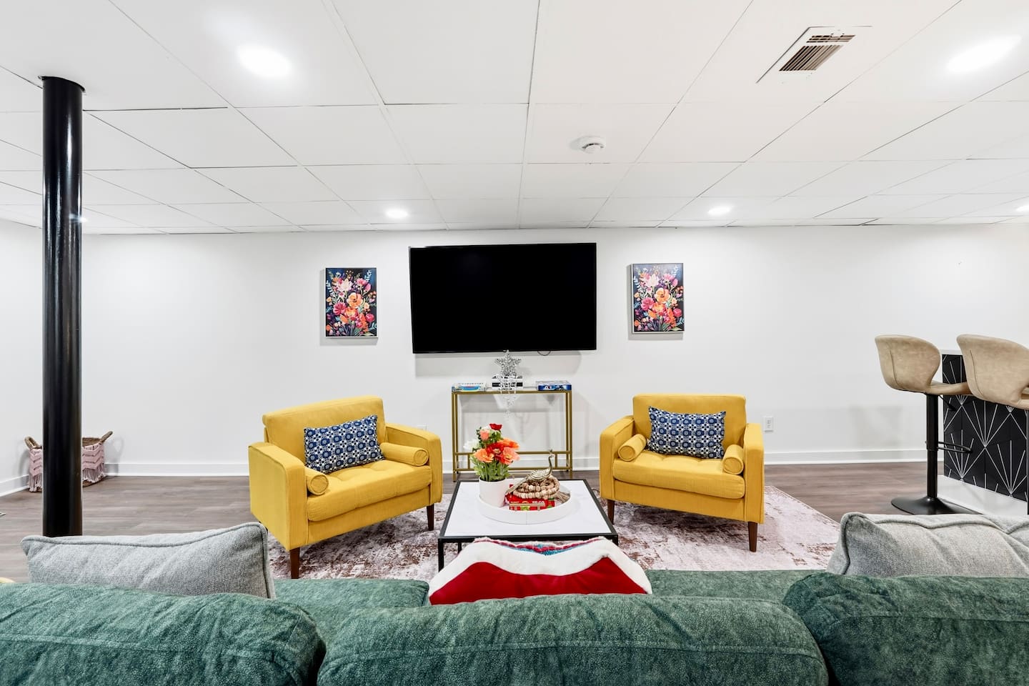 Amazing game room located in the basement, featuring a pool table, foosball table, and a stylish bar perfect for entertaining and relaxing with friends and family.