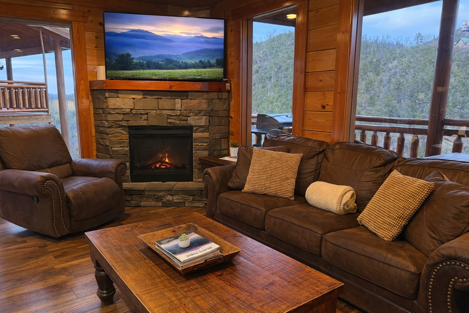 Plush seating, mountain views and a glowing fireplace—your perfect spot to unwind.