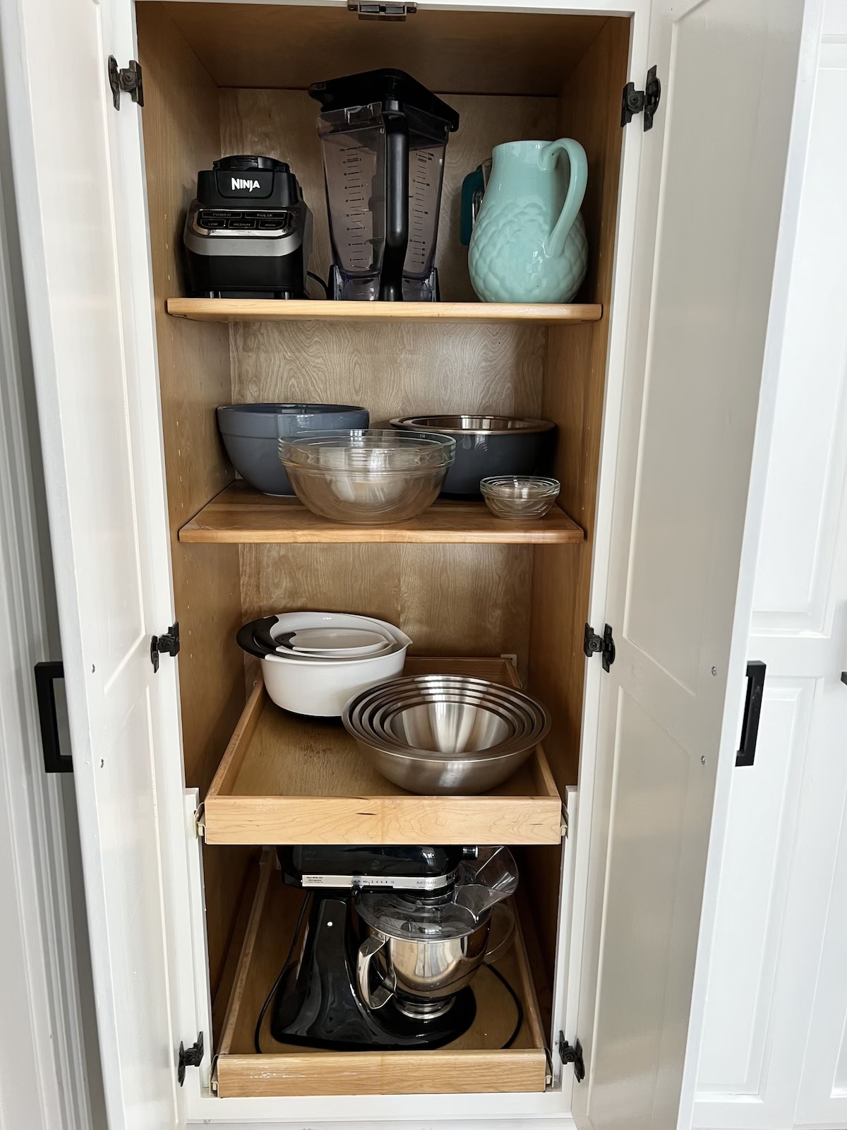 Well-appointed kitchen and pantry featuring numerous appliances for cooking, baking, drinks, and entertaining.