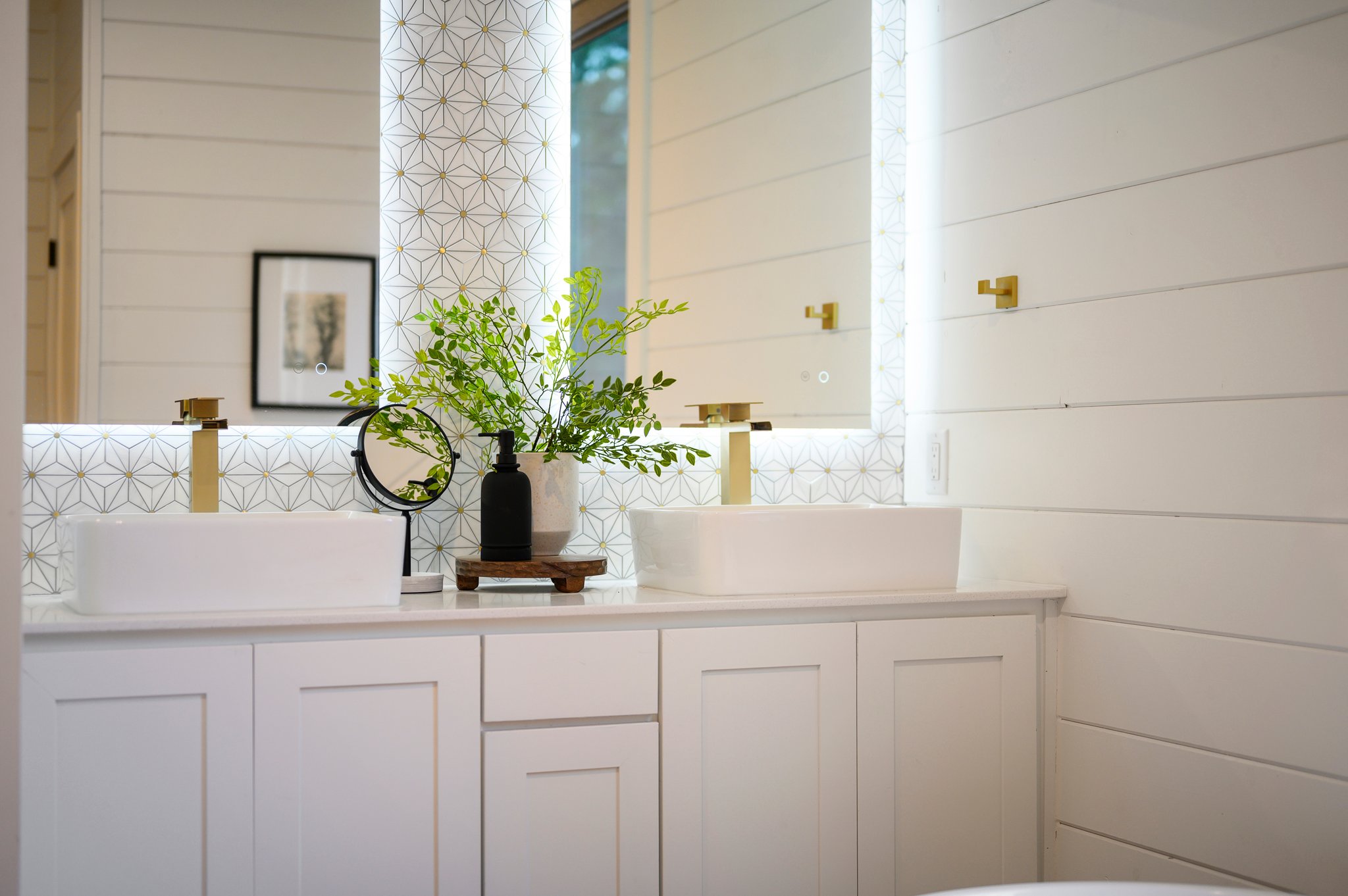 The double vanity with modern vessel sinks provides plenty of space to get ready.