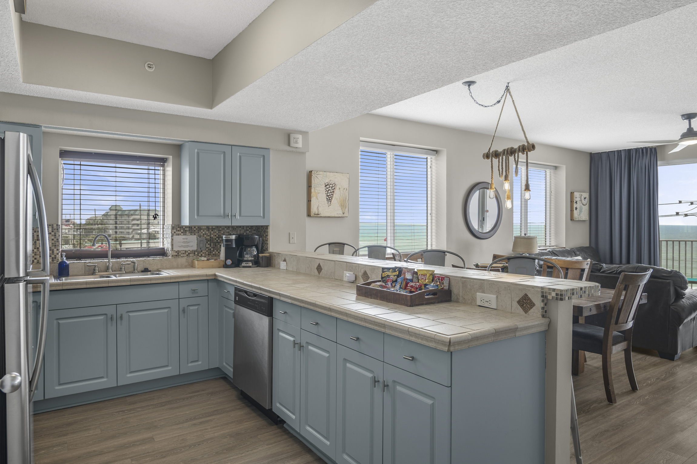 Kitchen has stainless appliances - fully stocked with more than the basics (coffee/tea bar, oils/spices, Tupperware, plenty of pots/pans/cookware)!