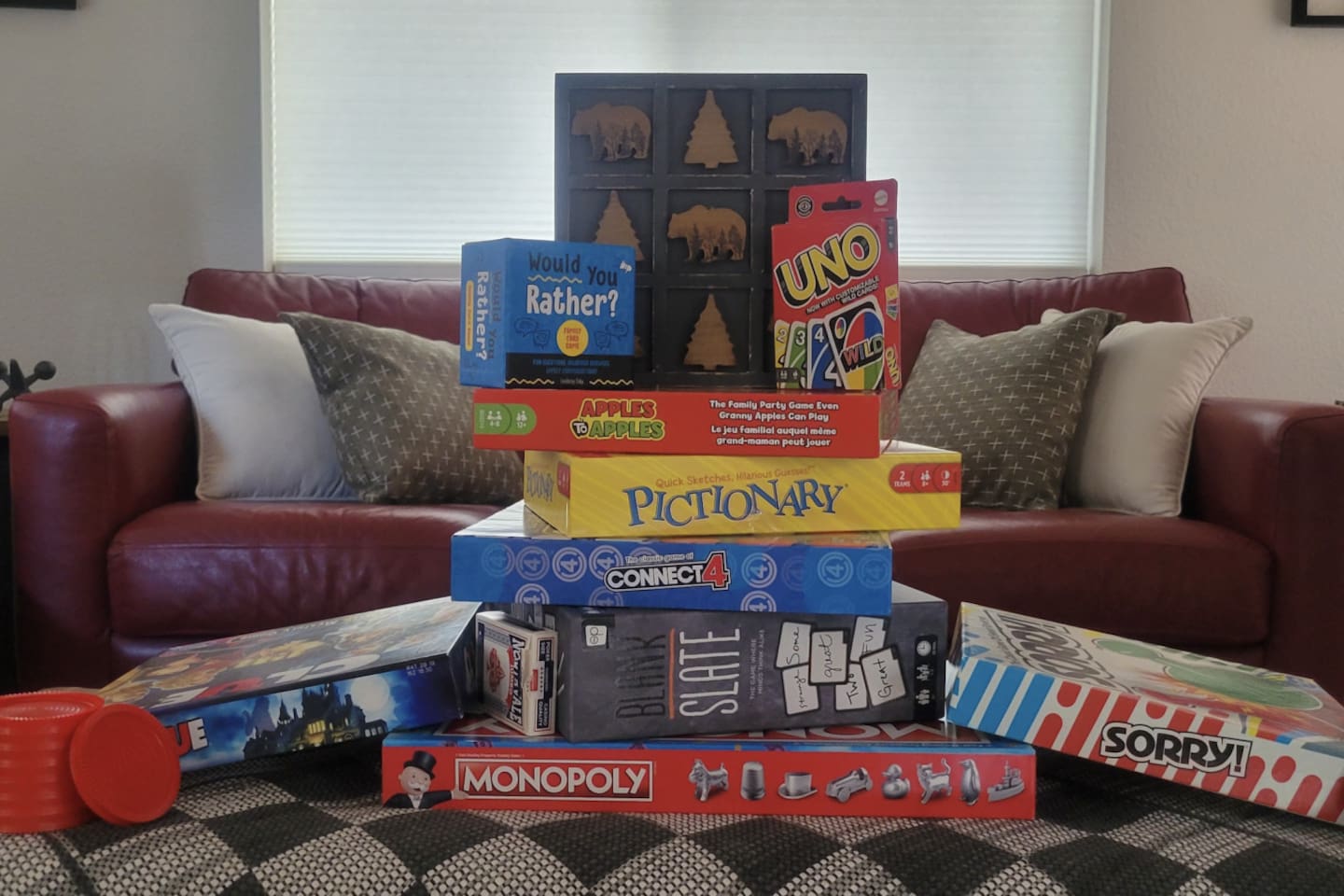 Indoor entertainment setup with board games and card games for all ages.