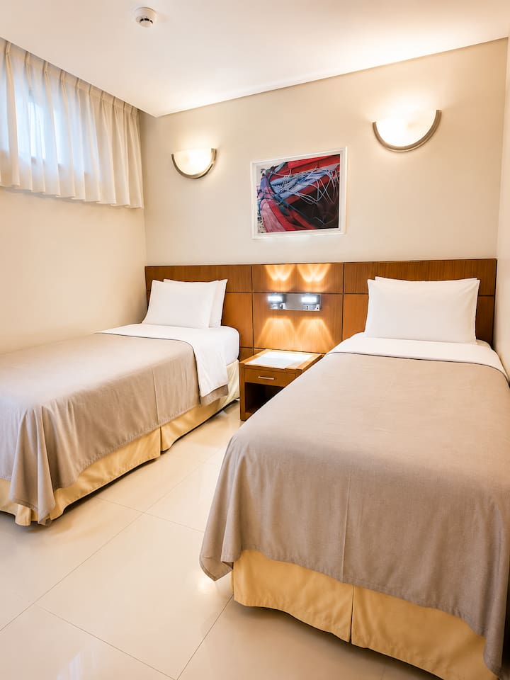Two single beds perfect for kids or groups or friends sharing. 