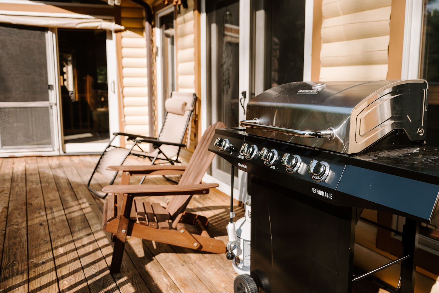 Propane grill on the back porch where the grill master has exceptional views.