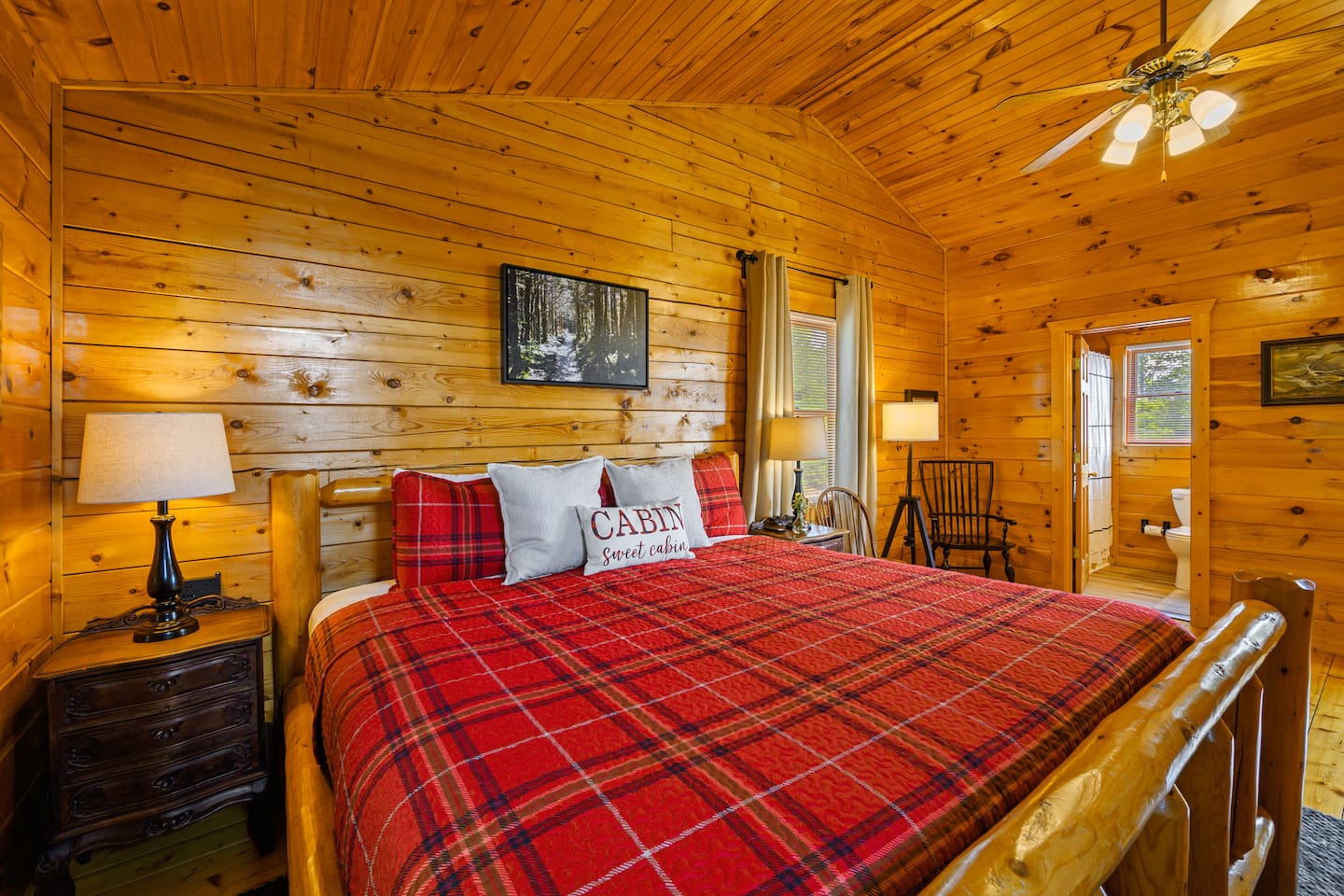 The top floor bedroom has a king bed, 43" smart TV, closet, dresser, 2 person jacuzzi tub, and ensuite full bathroom. 