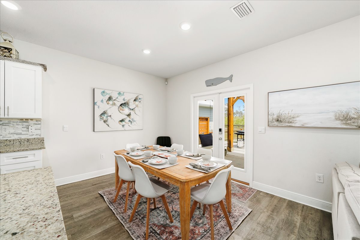 Enjoy meals together in this light-filled dining space with comfortable seating for six.