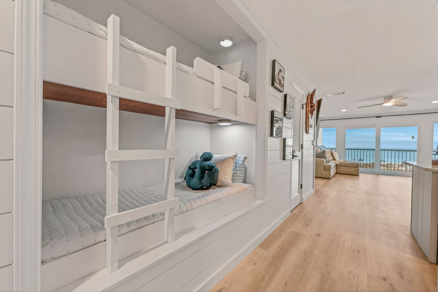 Hallway bunk bed with two twin sleeping spaces, separate from the private king bedroom.