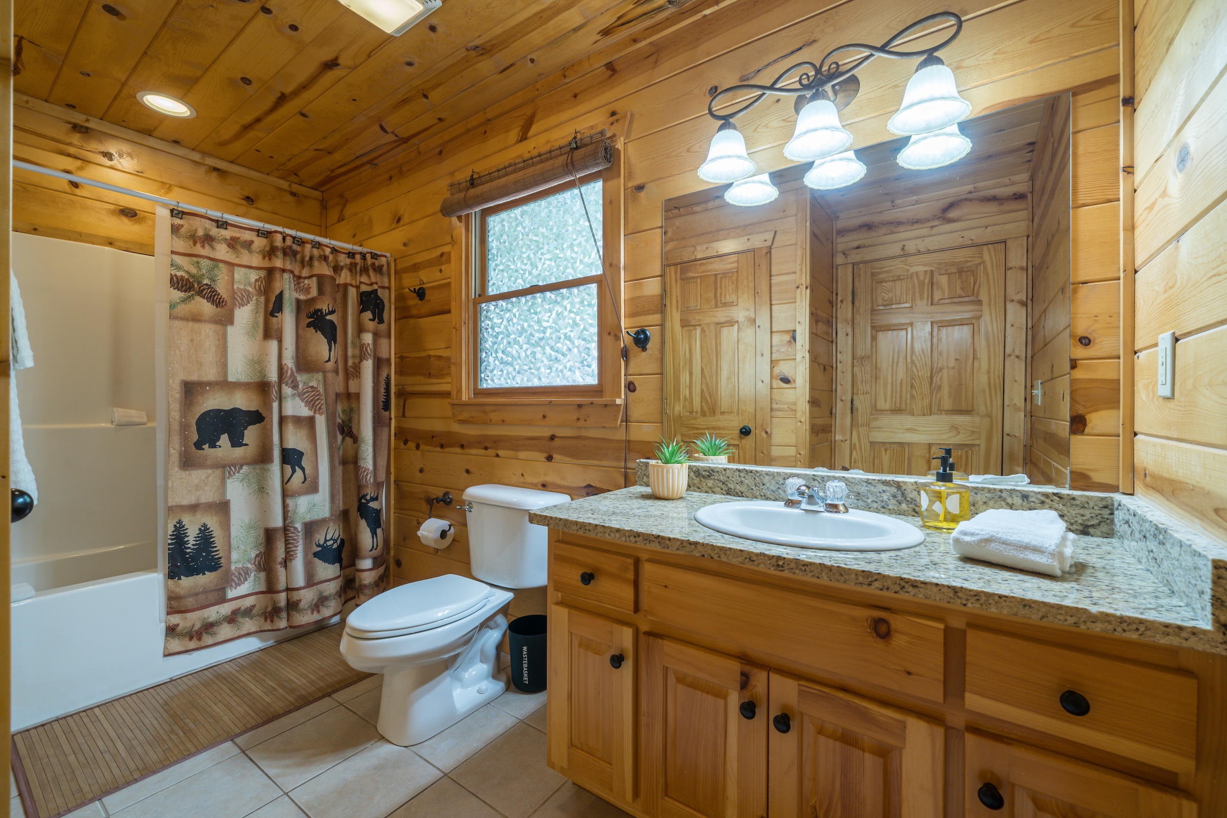 Full bath, tub/shower combo, right behind laundry area, off kitchen hallway. Complimentary shampoo, conditioner and shower gel are provided for! Towels sanitized, inspected and lint rolled at each turn!