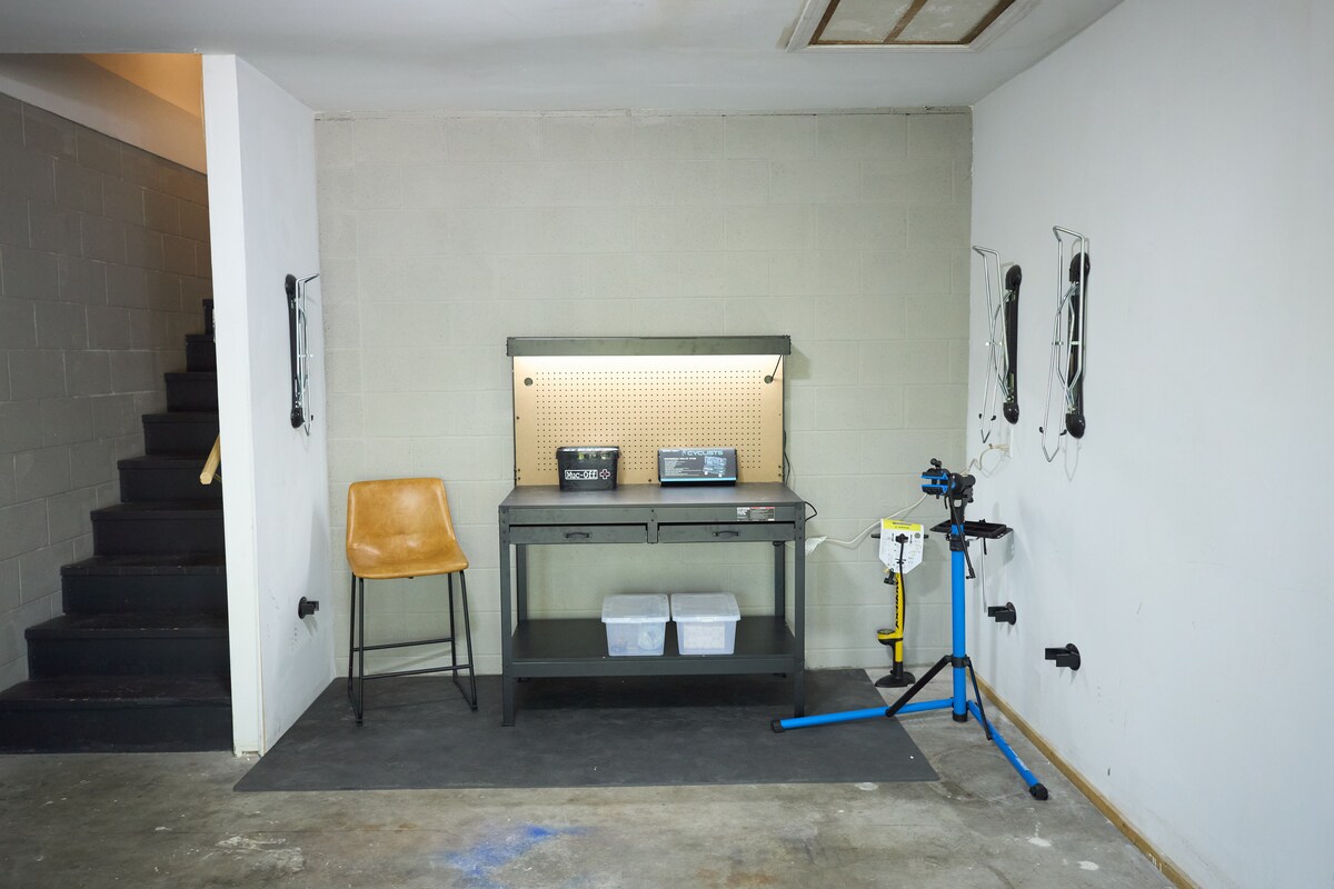 A dedicated bike storage and tuning station in the garage — perfect for cyclists visiting the Oz Trails.