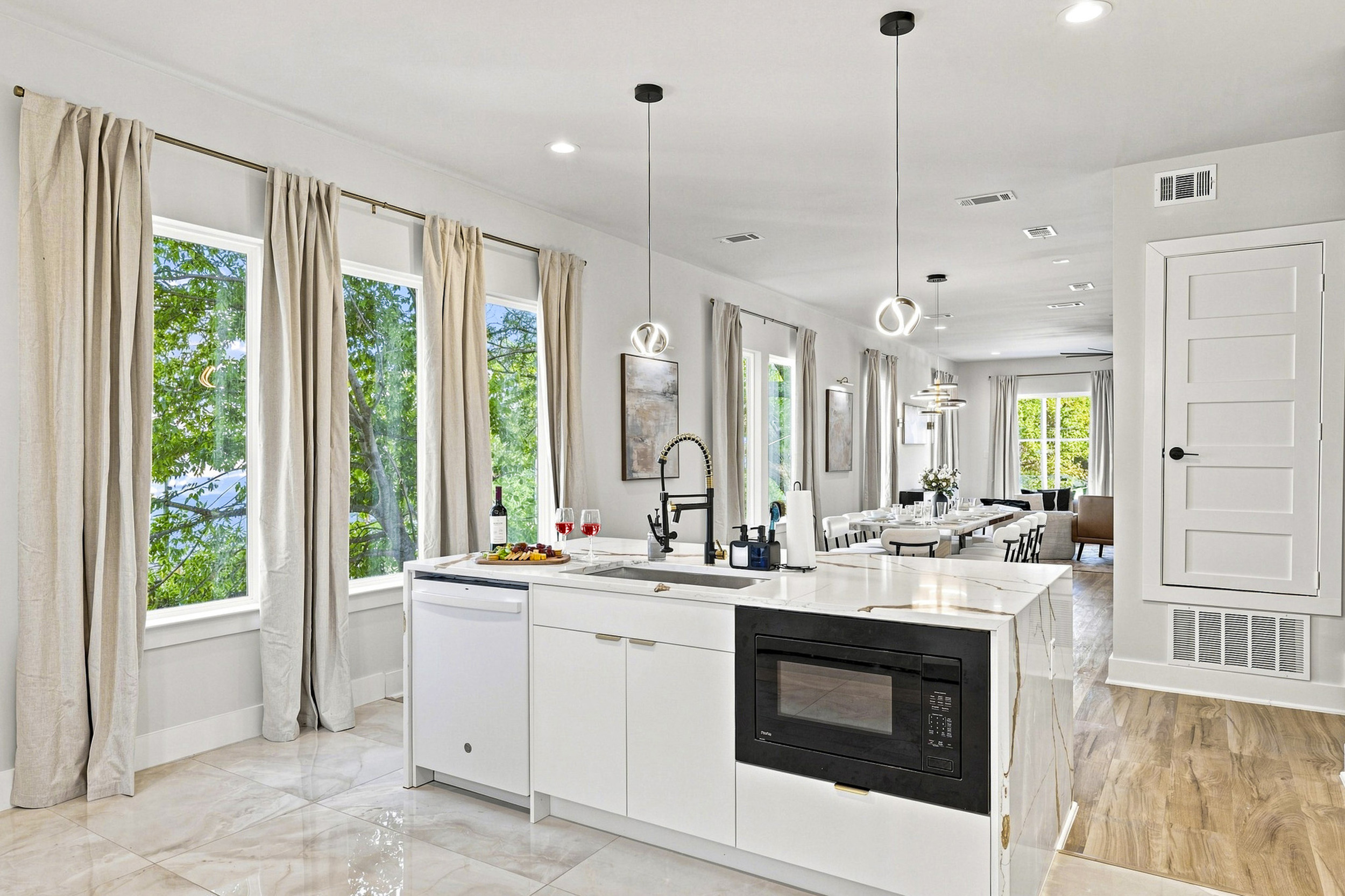 Sunlit space with modern appliances and stunning views, perfect for culinary adventures!