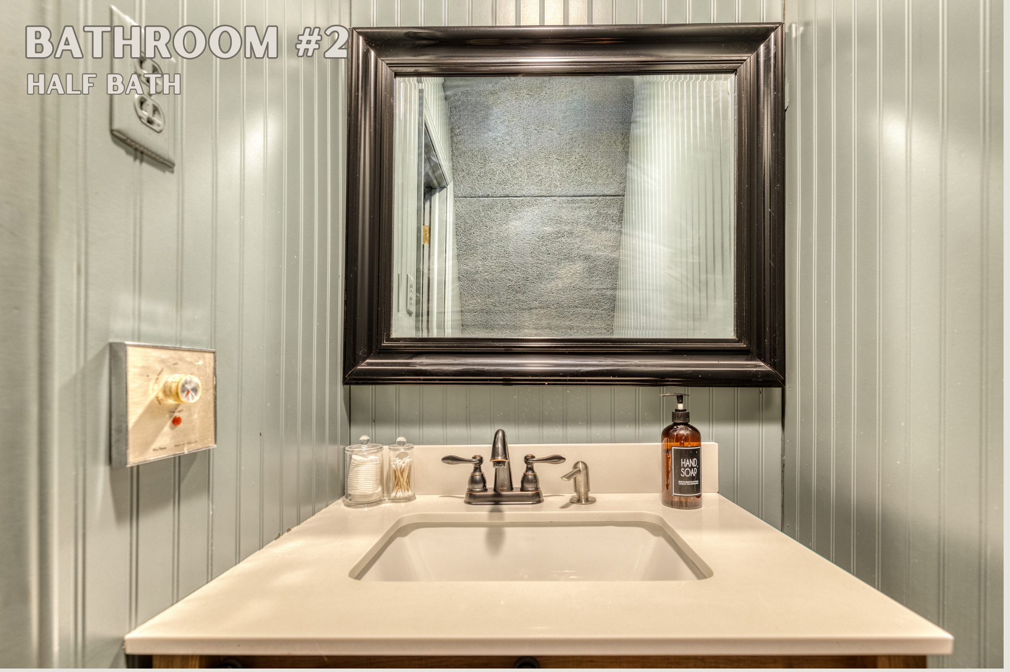 Bathroom #2, an en-suite half bath, offers convenience and style with its sleek sink and modern fixtures. This private space adds a touch of luxury to your stay.