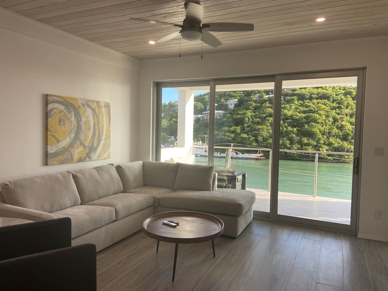 Living area with fabulous waterfront views.   Enjoy watching movies/sports on a 
70” flat screen TV.
